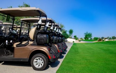 Background image of Golf carts parked on a golf closure in a line. Фото