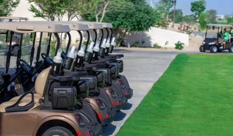 Background image of Golf carts parked on a golf closure in a line. Фото