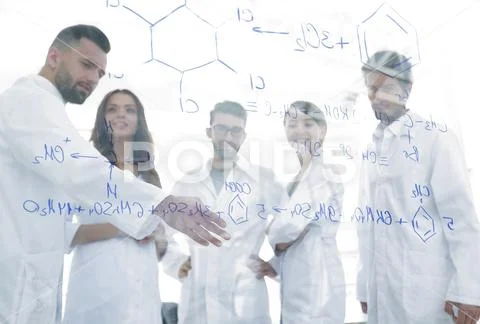 In the background image group laboratory scientists discussing their research Stock Photos