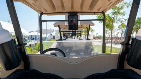 Background image of multiple golf carts parked in order. Stock Photos