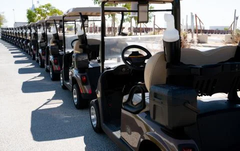 Background image of multiple golf carts parked in order. Stock-Fotos