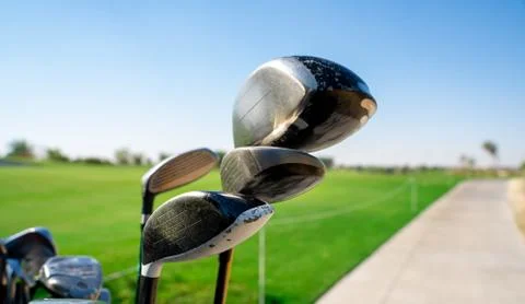 Background image of multiple golf sticks on the behind of a golf cart. 写真素材