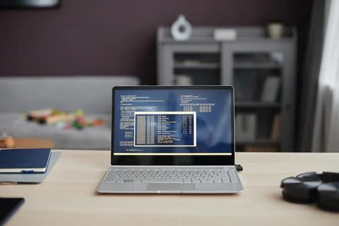 Background Image of Open Laptop with Code Lines on Screen Stock Photos