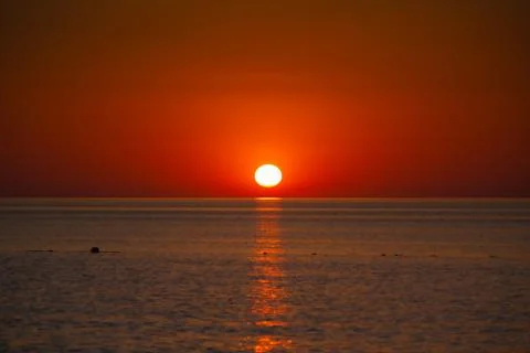 Background image of a orange sunset in Qatar during summer Stock Photos