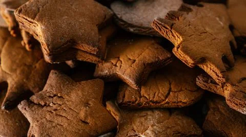 Background image of partially blurred gingerbread cookies in shape of christm Stock Photos