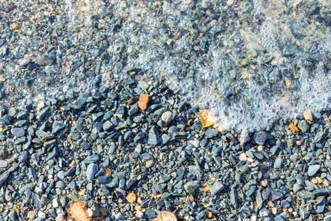 Background image of pebbles on a beach Stock Photos