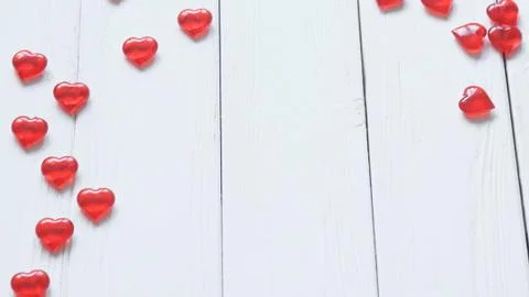 Background image of red hearts on light wooden background. Stock Photos