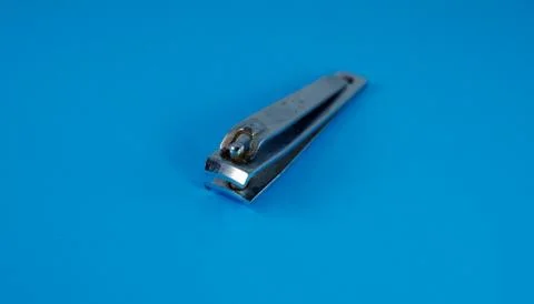 Background image of rusty nail cutters on a blue background. Stock Photos