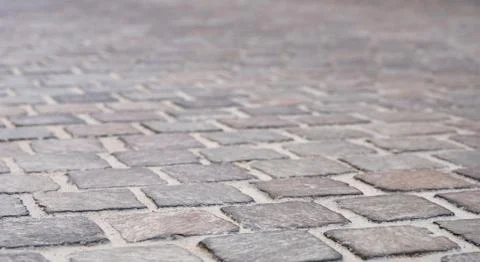 Background image of set of granite Grey brick stone street road. Light sidewa Stock Photos