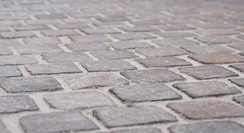 Background image of set of granite Grey brick stone street road. Light sidewa Stock Photos