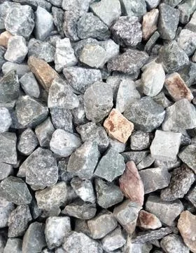 Background image of small rocks lined up on the floor Stock Photos