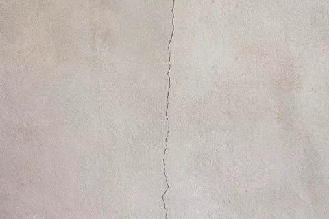 Background image of an unpainted plaster wall And there are cracks in the mid Stock Photos