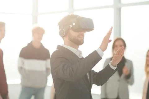 Background image of a young man in a virtual reality helmet Foto stock