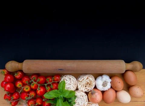 Background ingredients kitchen top view with noodles eggs tomatoes and fresh  Stock Photos