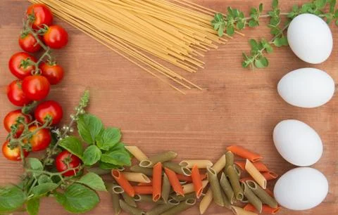 Background ingredients kitchen top view with noodles eggs tomatoes and fresh  Stock Photos