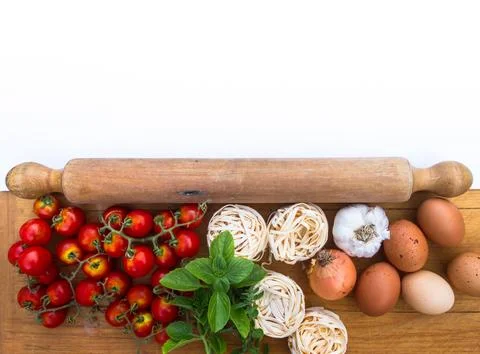 Background ingredients kitchen top view with noodles eggs tomatoes and fres.. Stock Photos