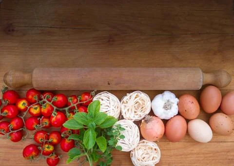 Background ingredients kitchen top view with noodles eggs tomatoes and fres.. Stock Photos