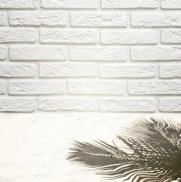 Background to insert an object on a brick wall and white sand with a shadow from Stock Photos