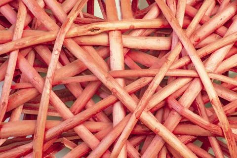 Background of intersecting intertwined lines of rustic ratana vine sticks i.. Stock Photos