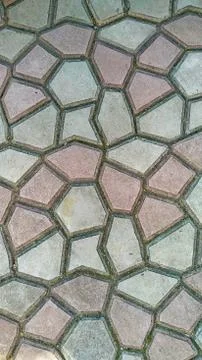 Background of irregular gray-pink cement tiles Stock Photos