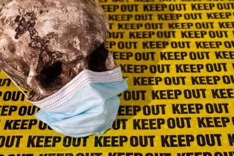 Background keep out, distance, warning sign, with human skull in medical mask Stock Photos