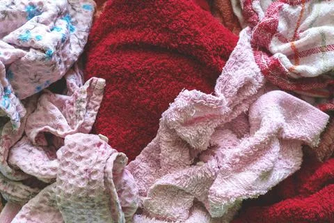 Background with kitchen towels. texture of multi-colored fabrics. Stock Photos