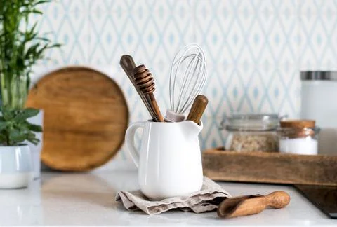 Background of kitchen utensils. Wooden objects for cooking. Copy space. Stock Photos