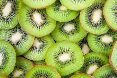 Background of kiwi slices Stock Photos