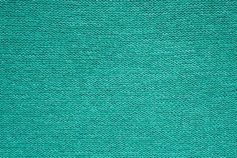 Background knitted fabric from a green thread, even pattern. Foto stock