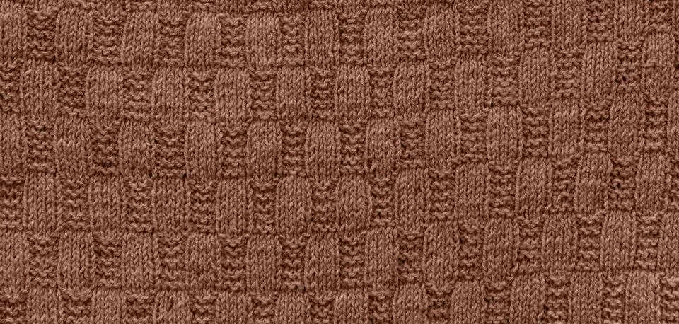 Background of knitting pattern. Mocha Mousse, Color of the Year 2025. Stock Photos