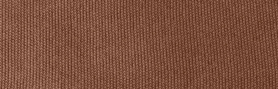 Background of knitting pattern. Mocha Mousse, Color of the Year 2025. 스톡 사진
