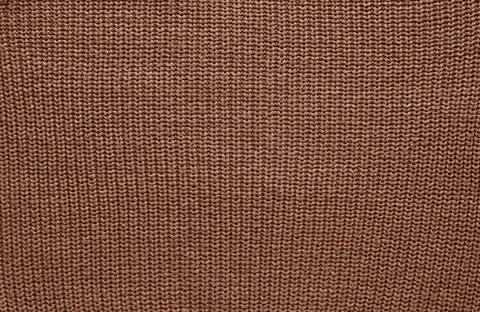 Background of knitting pattern. Mocha Mousse, Color of the Year 2025. 스톡 사진