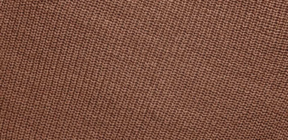 Background of knitting pattern. Mocha Mousse, Color of the Year 2025. 스톡 사진