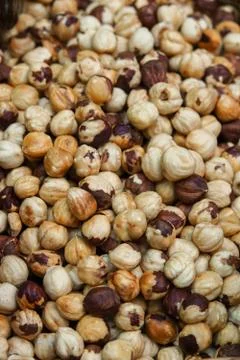 Background of the laid hazelnut. Stock Photos