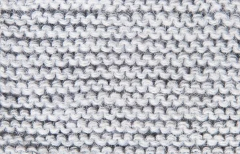 Background large knitted woolen threads of gray Stock Photos
