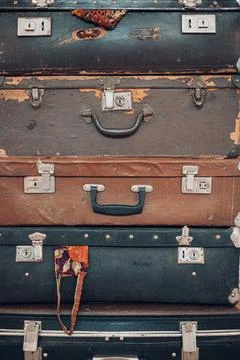Background with large stack of antique suitcases . close up view Stock Photos