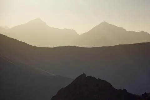 Background layered mountains at sunset Stock Photos