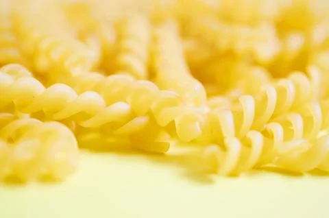 Background layout from the pasta. Spirals Stock Photos