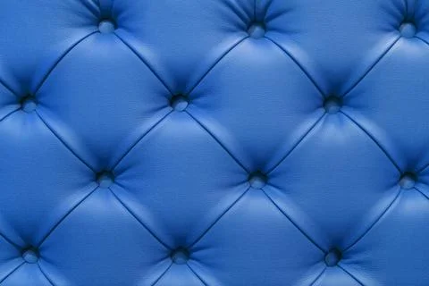 Background of leather blue sofa, stitched buttons. Stock Photos