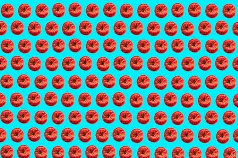 Background in light blue with a pattern of tomatoes. Stock Photos