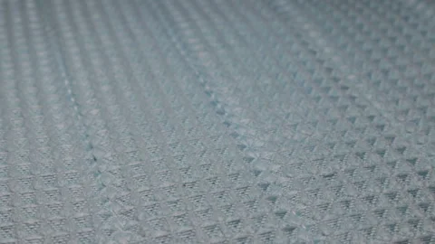 Background of a light green gingham cloth in extreme close-up on a rotating Stock Footage 152086719