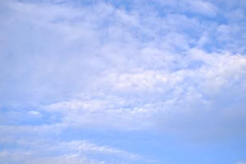 Background light sky gradient, close-up of beautiful white fluffy clouds in b Stock Photos