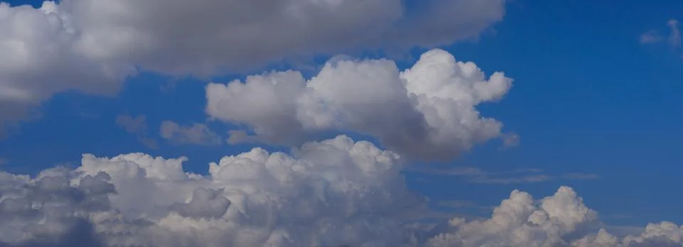 Background light sky gradient, close-up of beautiful white fluffy clouds in b Stock Photos