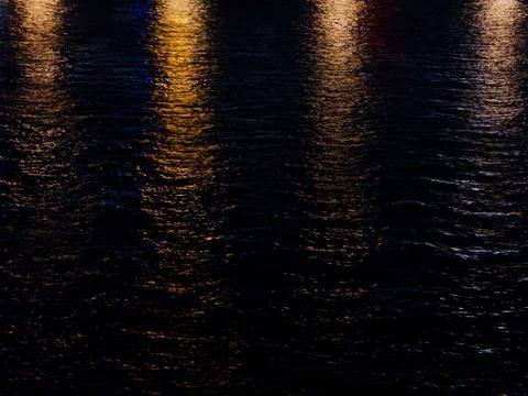 Background of lights reflected in river water Stock Photos