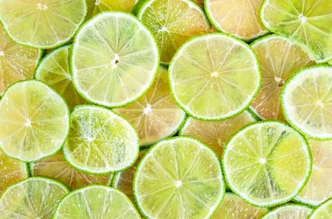 Background of lime slices Stock Photos