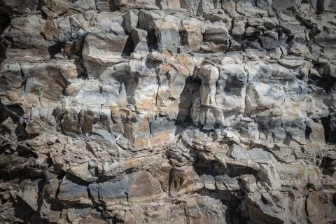 Background of limestone masonry. The surface is decorated with natural material Stock Photos