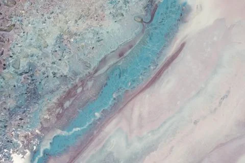 Background liquid marble of soft pink and blue color. Streams of delicate blues, Stock Photos