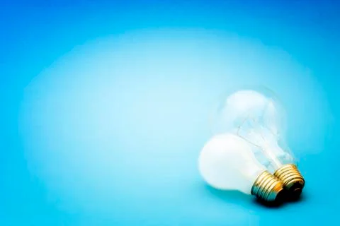 Background with lit lightbulb Stock Photos