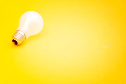Background with lit lightbulb Stock Photos