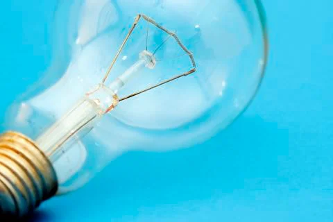 Background with lit lightbulb Stock-Fotos